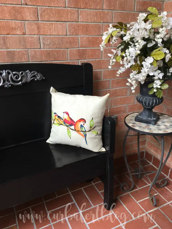Bench with pillow on it